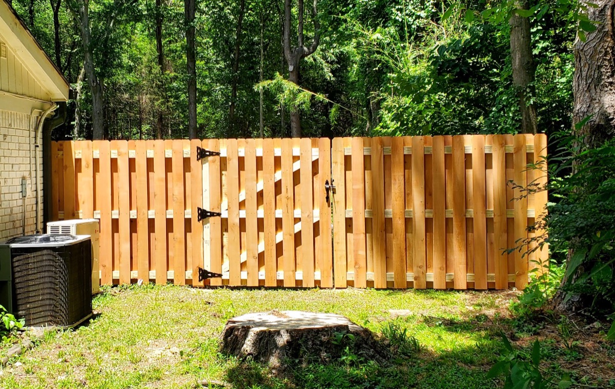 Double shadowbox gate in wooded backyard setting