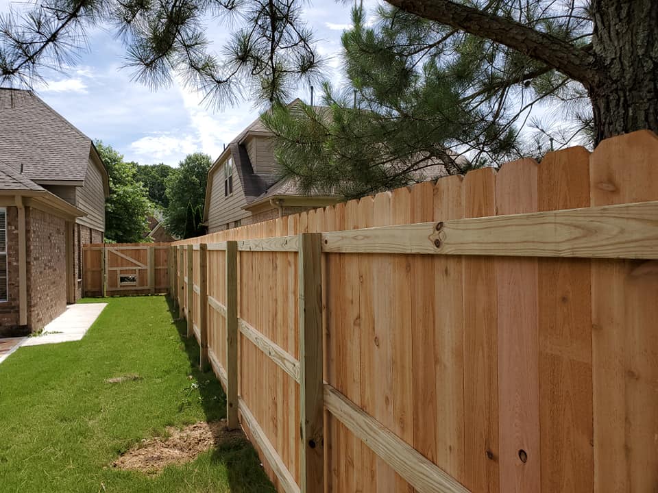 Back rail view of wood privacy fence showing quality framing