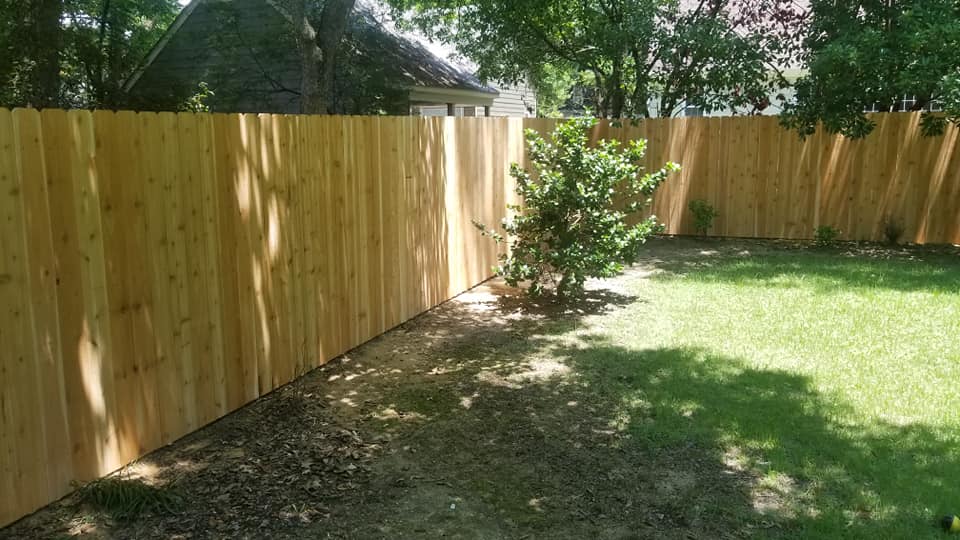Wood privacy fence corner installation with gate hardware